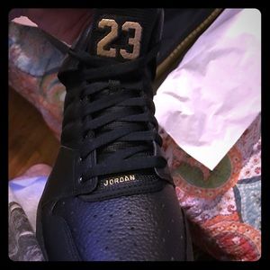 Black and gold Jordans